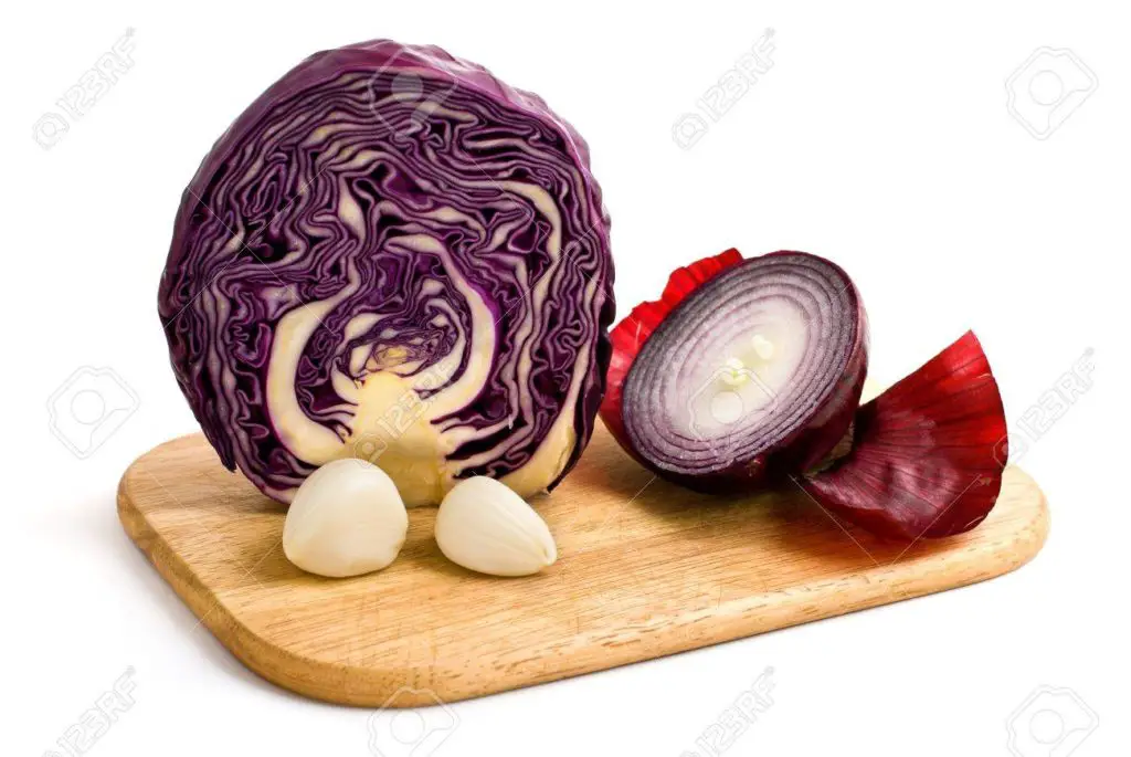 half-of-cabbage-two-cloves-garlic-and-half-of-red-onion-isolated-on-a-white-background