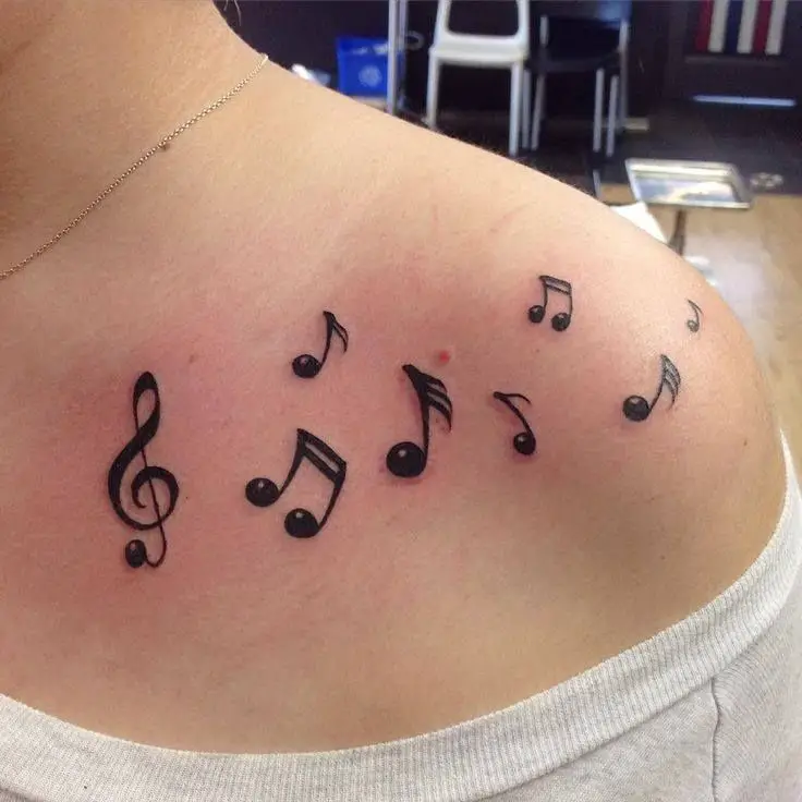 Scattered Music Note Tattoo