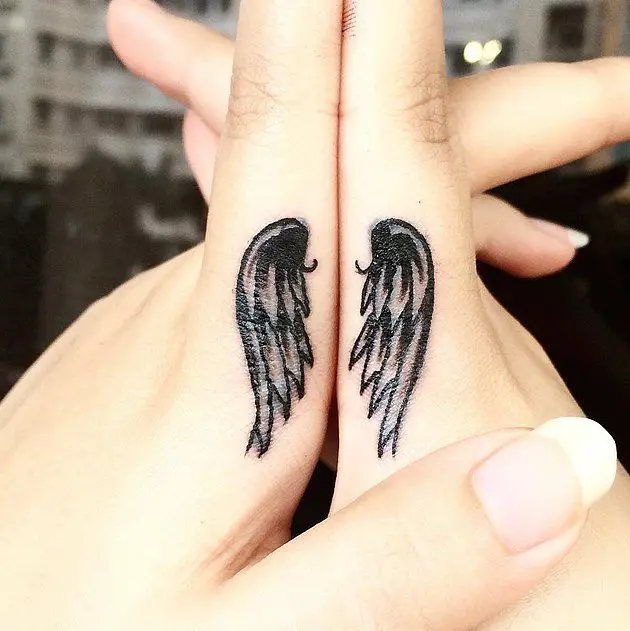 Small Angel Wings Tattoo On Finger