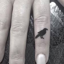 bird finger tattoo