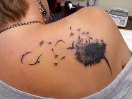 dandelion bird shoulder tattoo