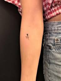 minimalist rose tattoo