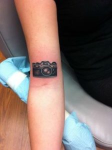 Camera tattoo on hand