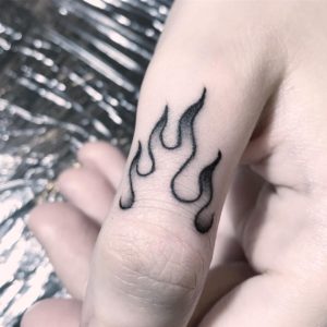fire finger tattoo