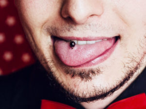 Midline Tongue Piercing for men