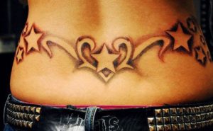 stars lower back tattoo