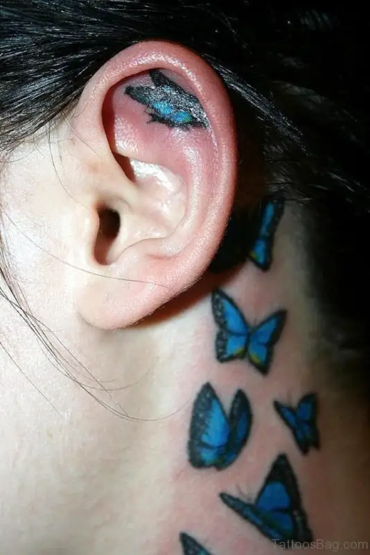 Blue Butterfly Tattoo Behind Ear.