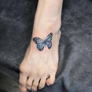 Blue Butterfly Tattoo On Foot