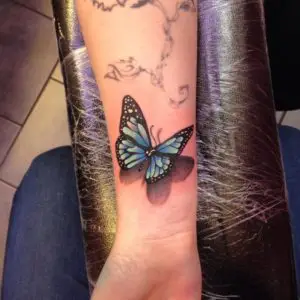 Blue Butterfly Tattoo On Wrist