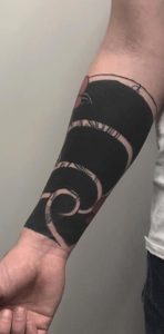 Black Out Wrist Tattoo