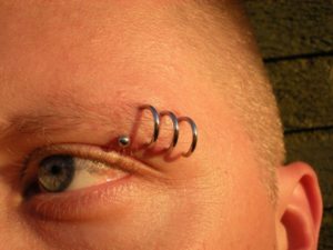 Corkscrew Eyebrow Piercing