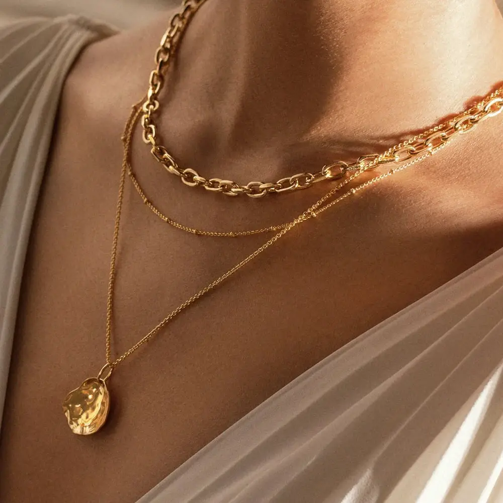 When wearing high-neck jewelry, pair it with a necklace.