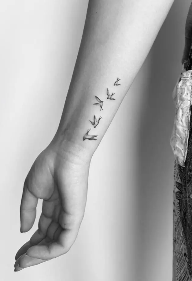 Birds In The Sky Arm Tattoo