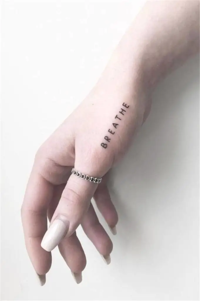Word Tattoo On Thumb