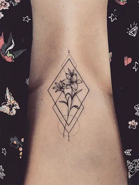 Geometric And Floral Chest Tattoo