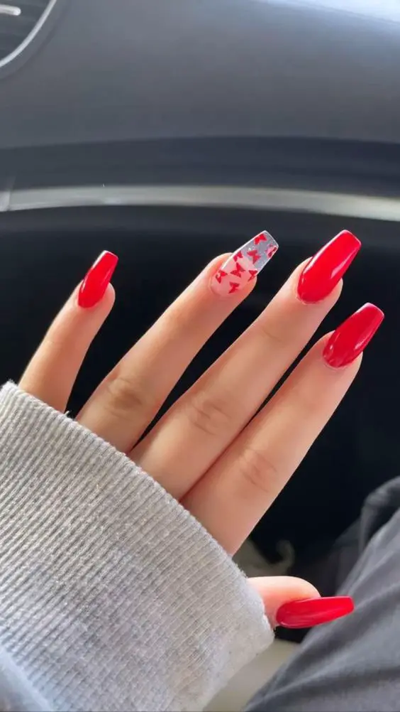 Red Acrylics And Single Clear Nail With Butterfly Art
