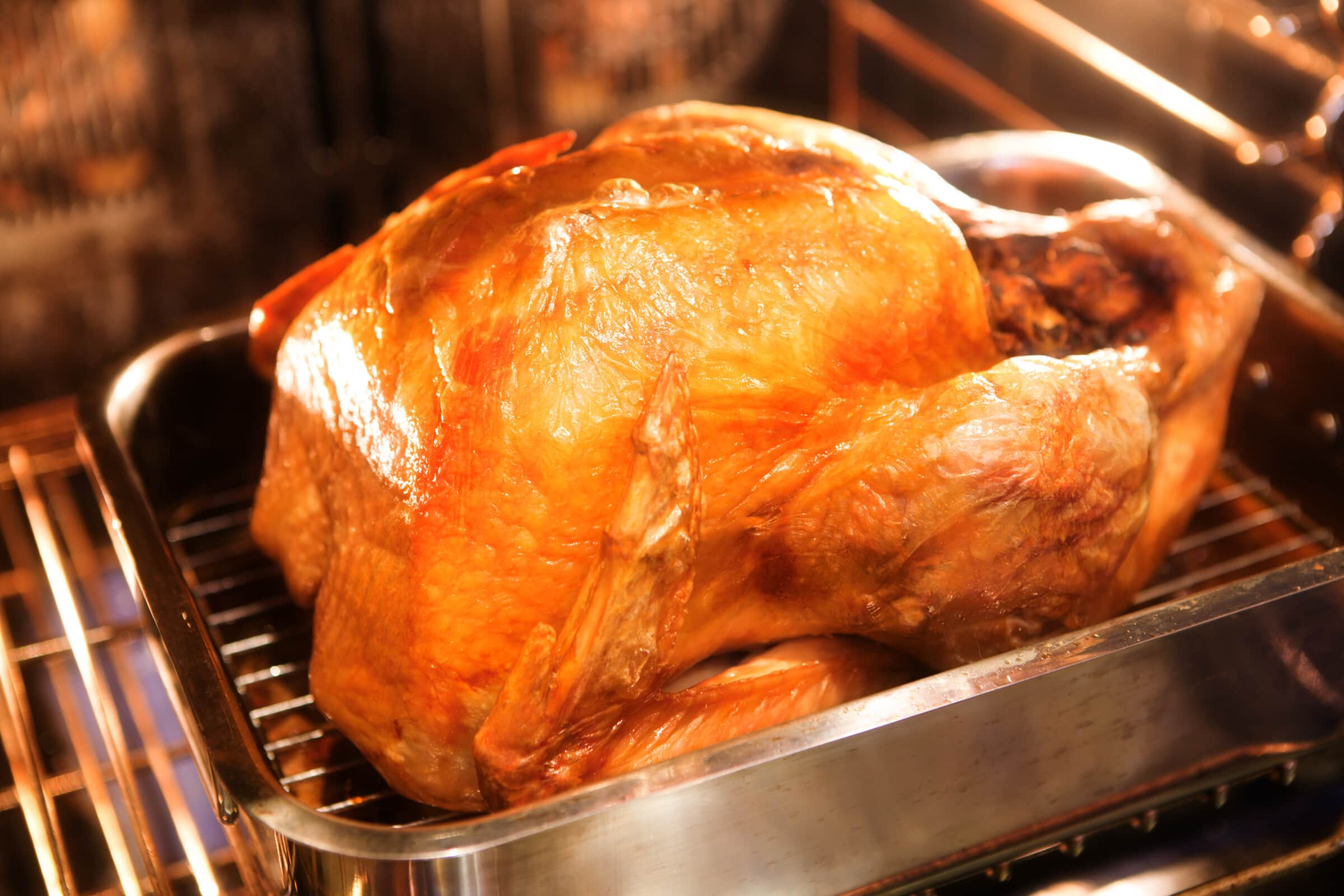 Should you add water in the roasting pan for the turkey?
